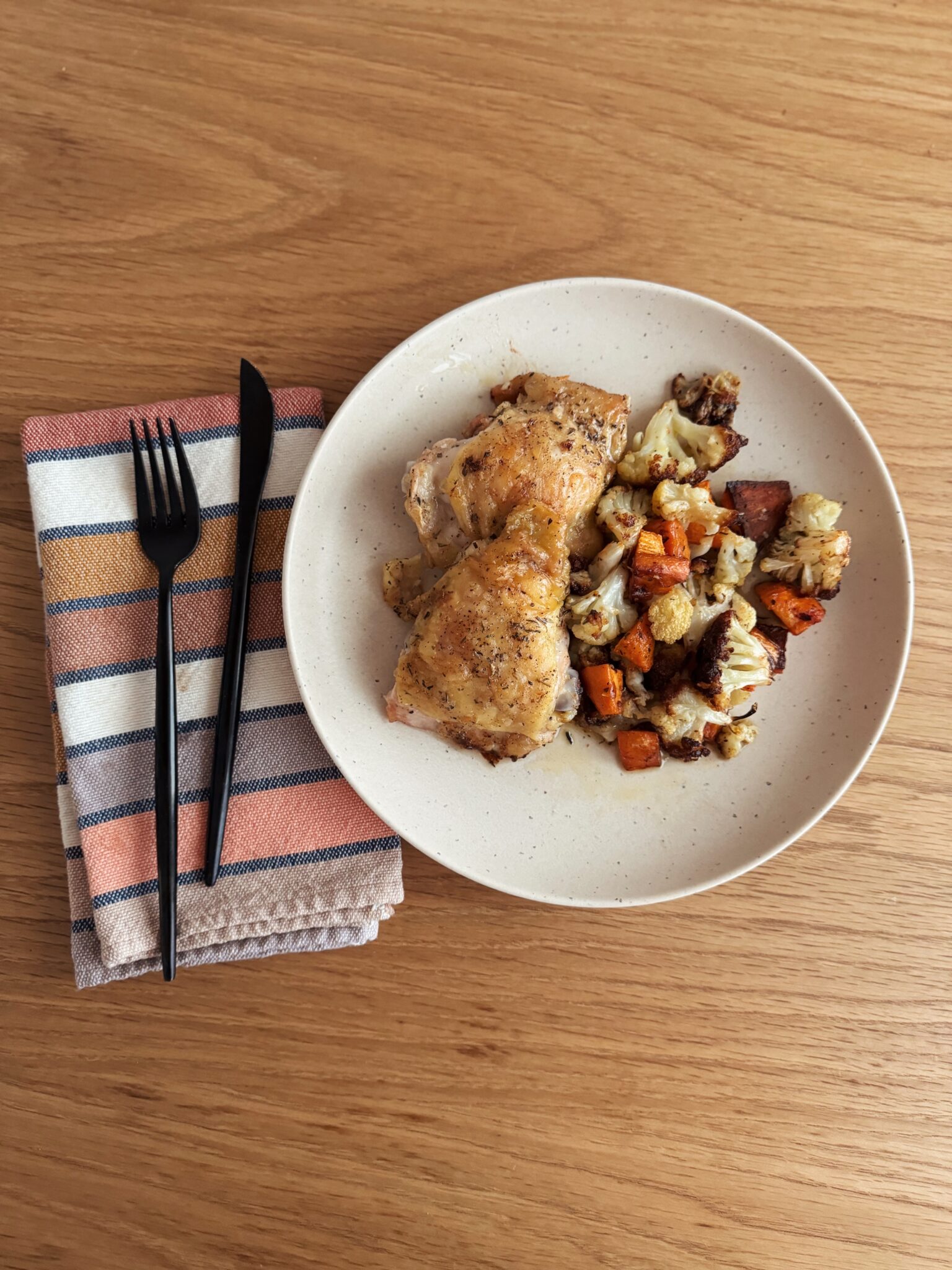 sheet pan chicken thighs with sweet potato and cauliflower hash