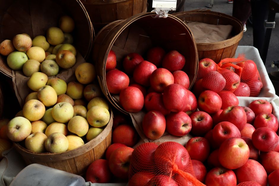 Colorful display of fresh apples at a Los Angeles farmer's market.